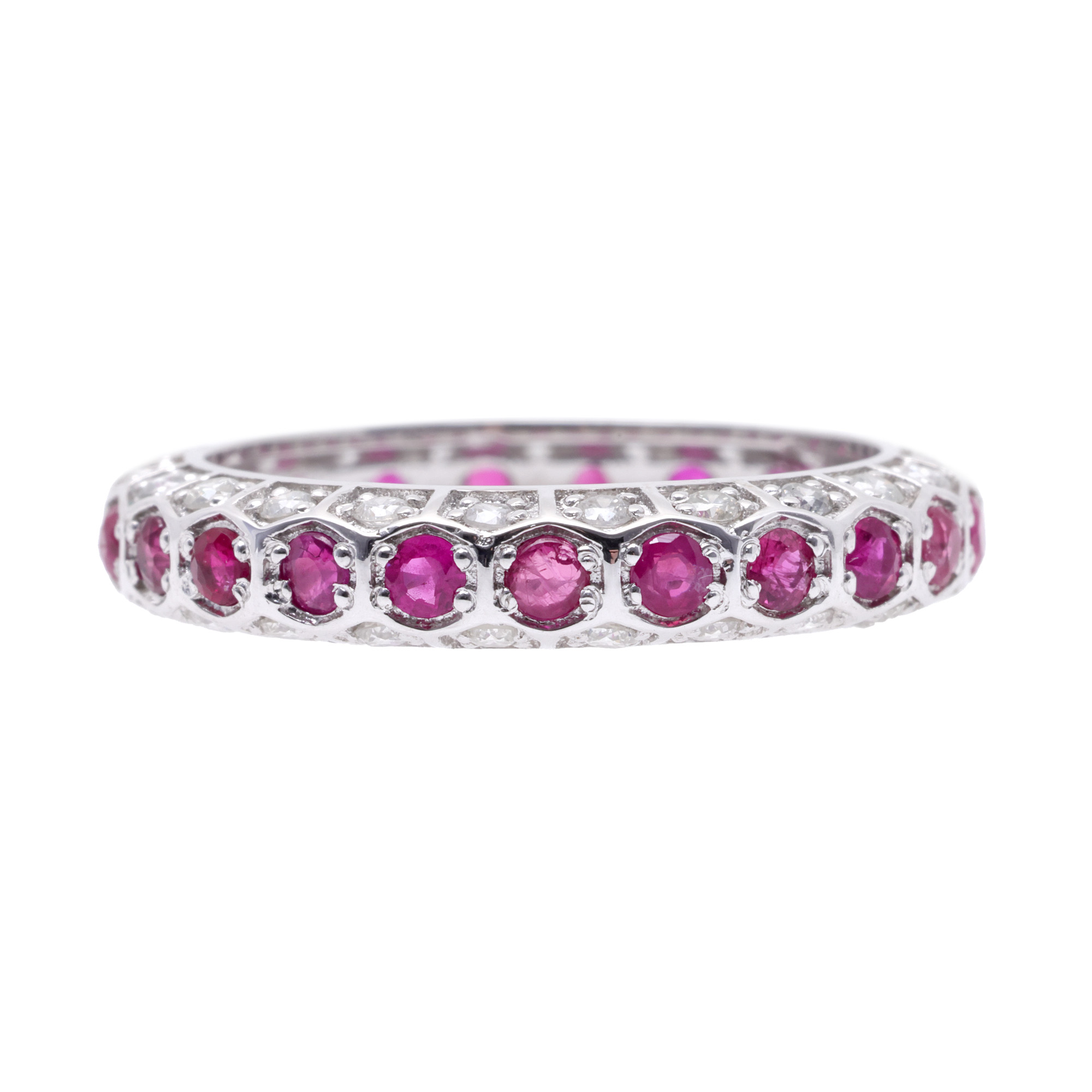 White gold infinity ring, decorated with diamonds and rubies, accompanied by the original box