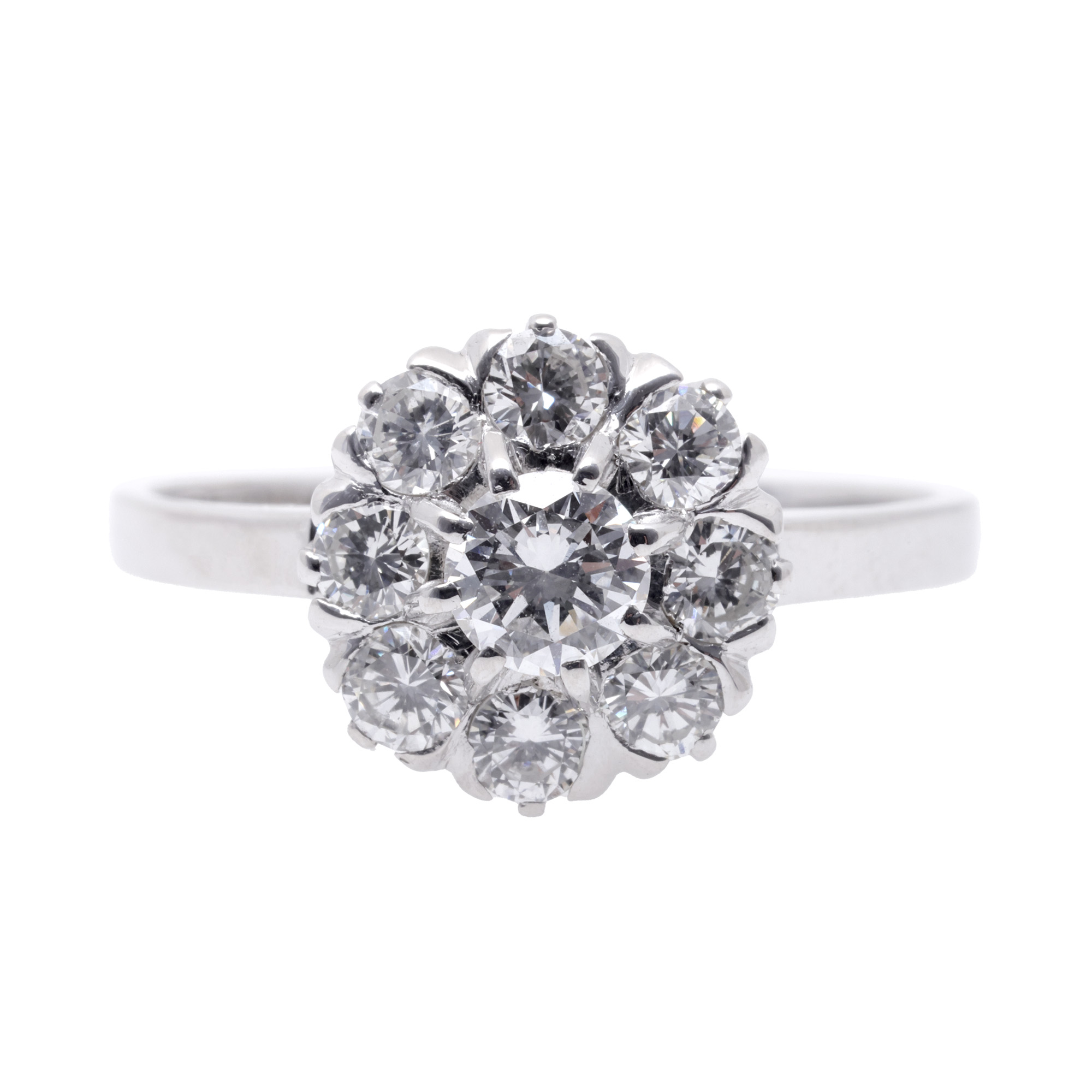 White gold ring in the shape of a flower, decorated with diamonds