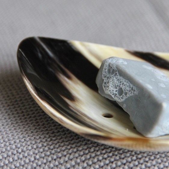 A range of natural horn handmade accessories for use in the bathroom.