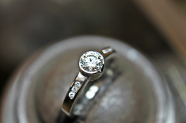 Brilliant cut solitaire and channel set shoulders