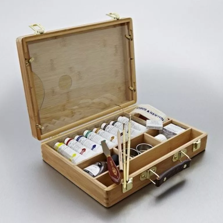 Painting Pink Poodles and Other Creatures with acrylic paint set that arrived confidently in a wooden briefcase