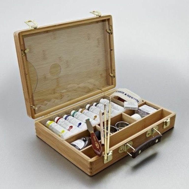 Painting Pink Poodles and Other Creatures with acrylic paint set that arrived confidently in a wooden briefcase