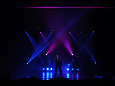 Human League tribute sings on stage out to an audience.
