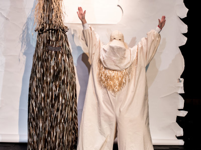 Two abstract characters stand side-by-side