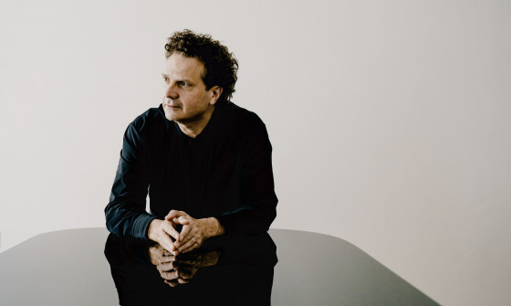 Andreas Haefliger sits at a piano