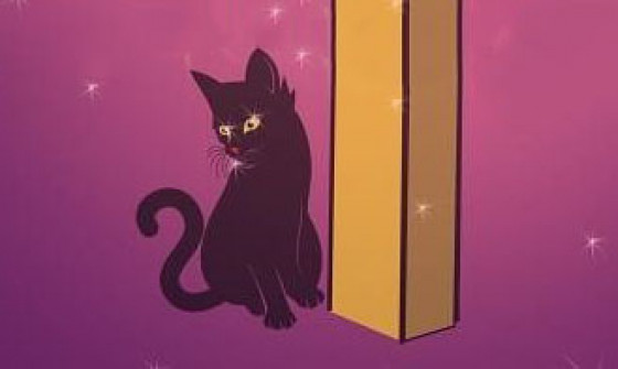 A cat sits next to a sign post.