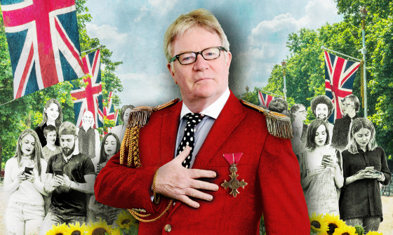 Jim Davidson stands with his hand on his heart, wearing badges of honour. The Union Jack flag falls above his head in the background, with people texting on their phones.