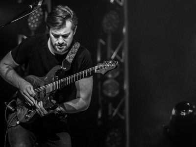 A black and white shot of a guitarist