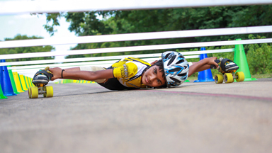 How Low Can He Go? Backward Limbo Skater Slides Under Cars in Reverse