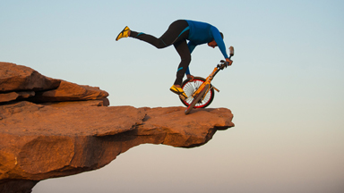 Clifftop BMX Yoga: Extreme 68-year-old Performs On Bike 300ft Above Ground