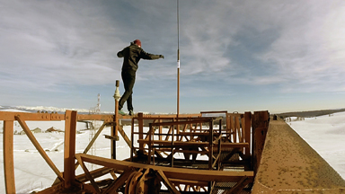 Unicyclist Performs On Abandoned Wind Turbine