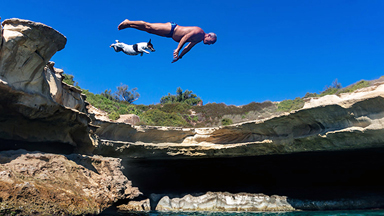 Diving Dog: Pet Jack Russell ‘Titti’ Jumps From Rocks With Her Owner