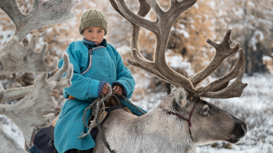 Navigate the snowy landscapes of Mongolia with this reindeer herding family