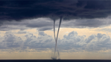 Twist and Spout! Twin Waterspouts Spin in the Ocean