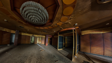 Exploring the depths of a vast abandoned theatre housing hard up locals