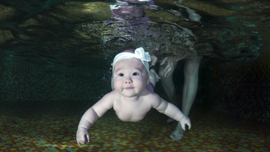 Nirvana baby meets his match in swimming infants