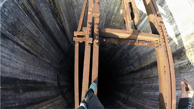 On Top of the World: Daredevil Climbs Chimney Tower