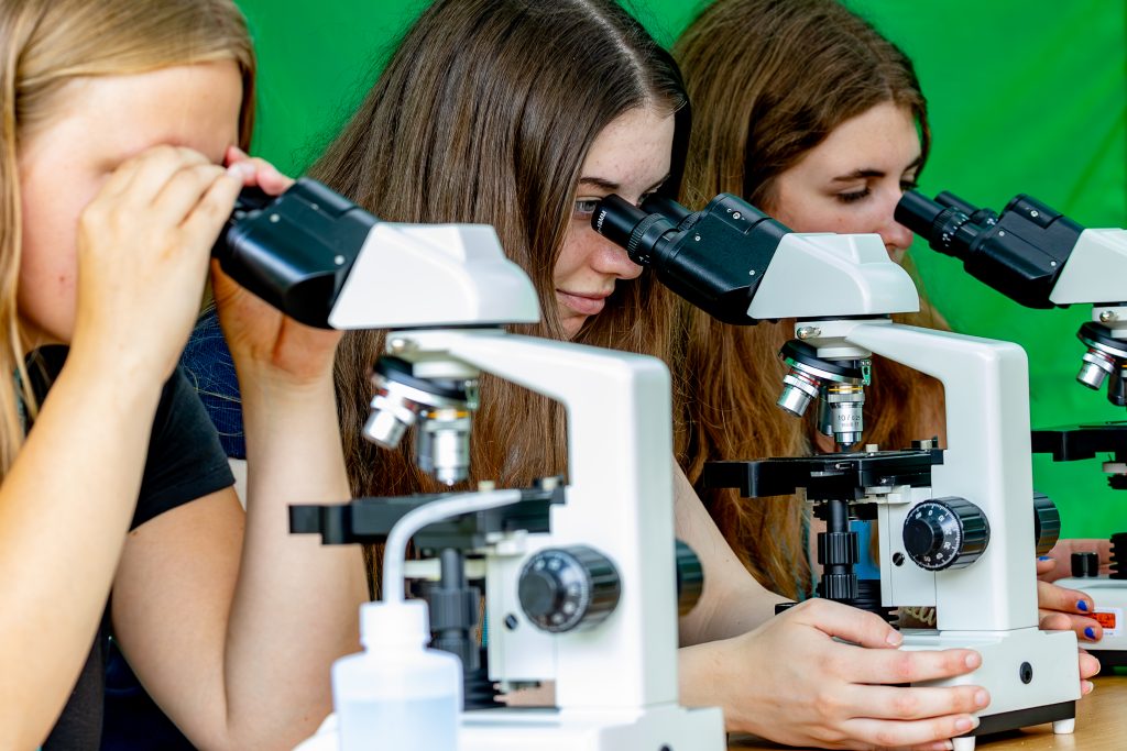 Students using microscopes