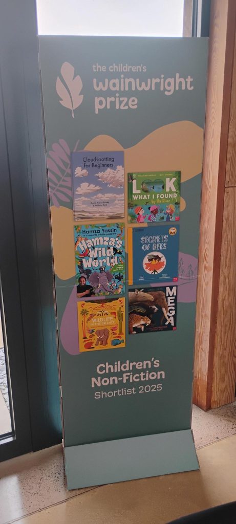 A display board with front covers of various children's books.