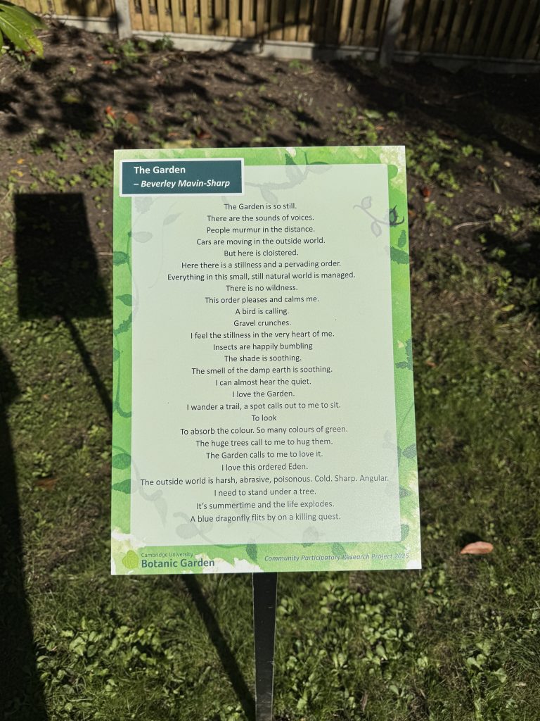 A raised sign showing a poem in Cambridge University Botanic Garden.