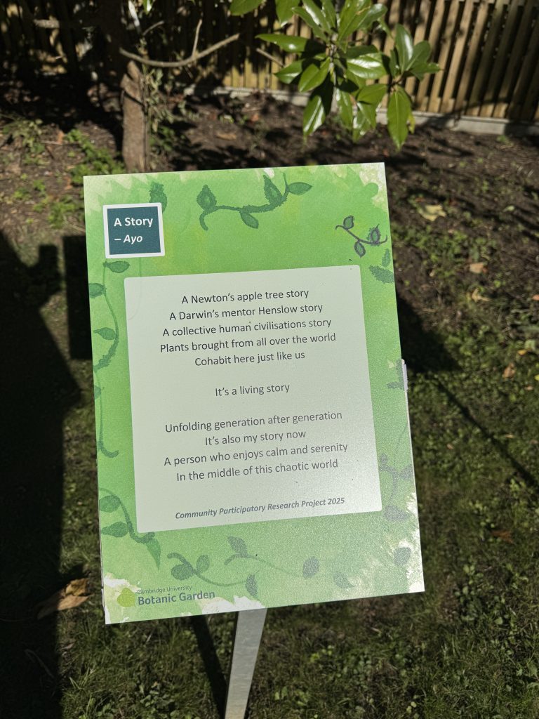 A raised sign showing a poem in Cambridge University Botanic Garden.