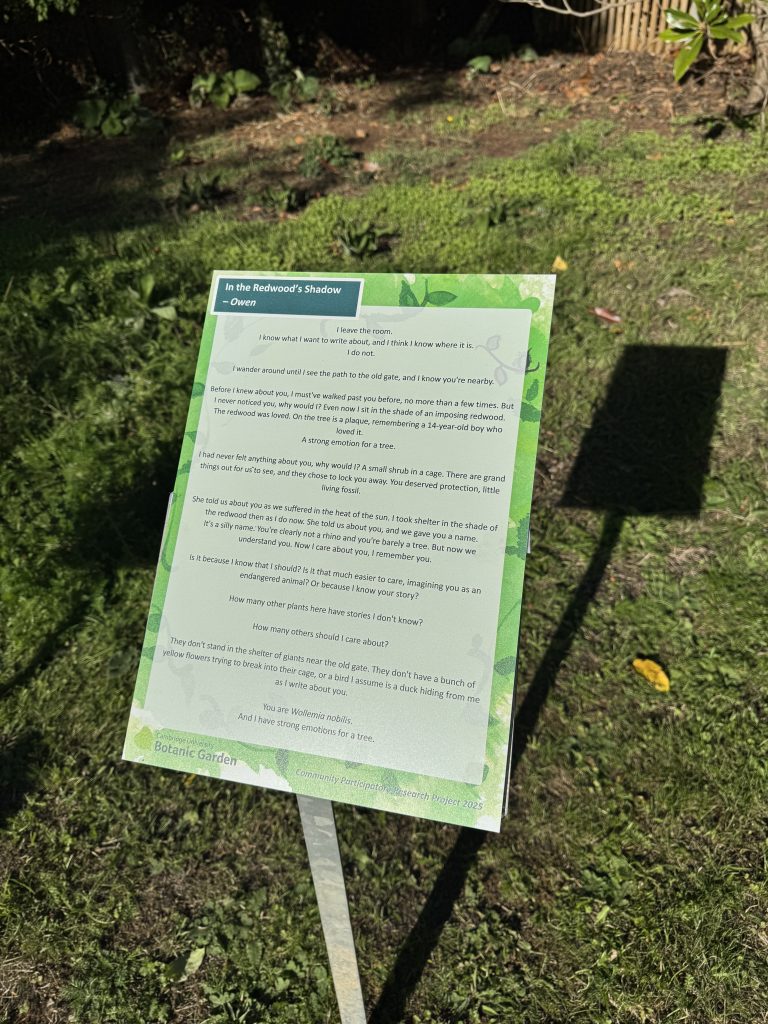 A raised sign showing a poem in Cambridge University Botanic Garden.