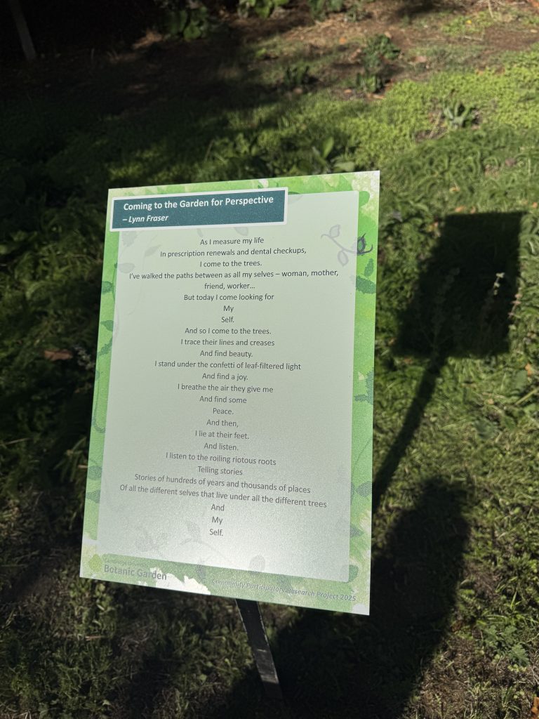A raised sign showing a poem in Cambridge University Botanic Garden.