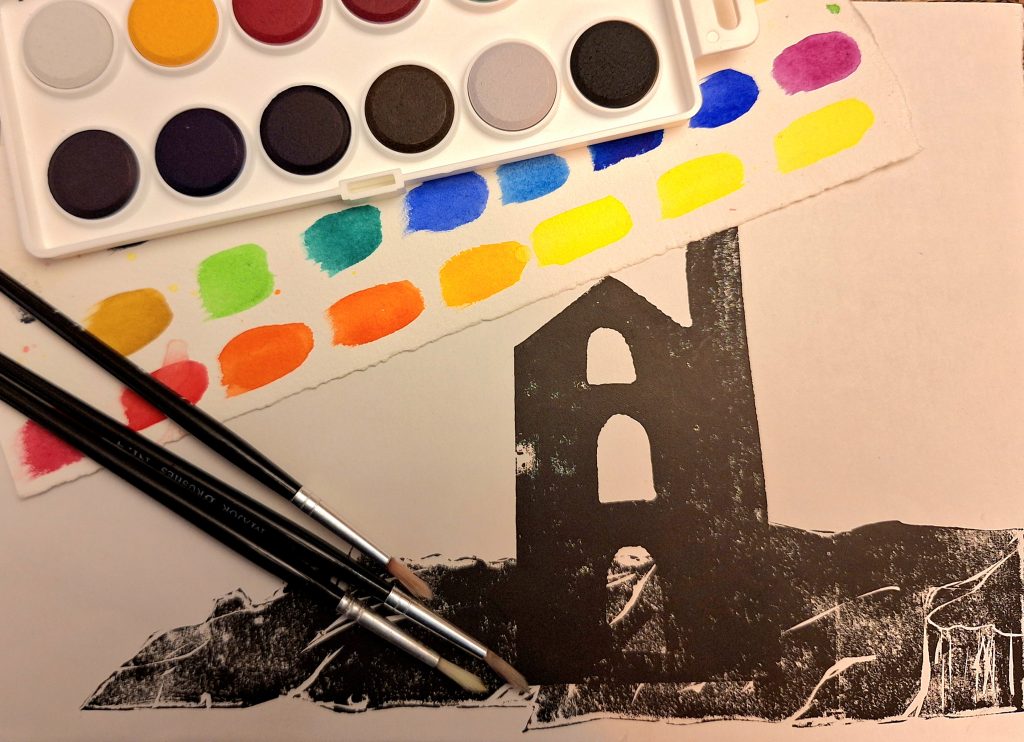 a linocut image of a building with paints and paintbrushes