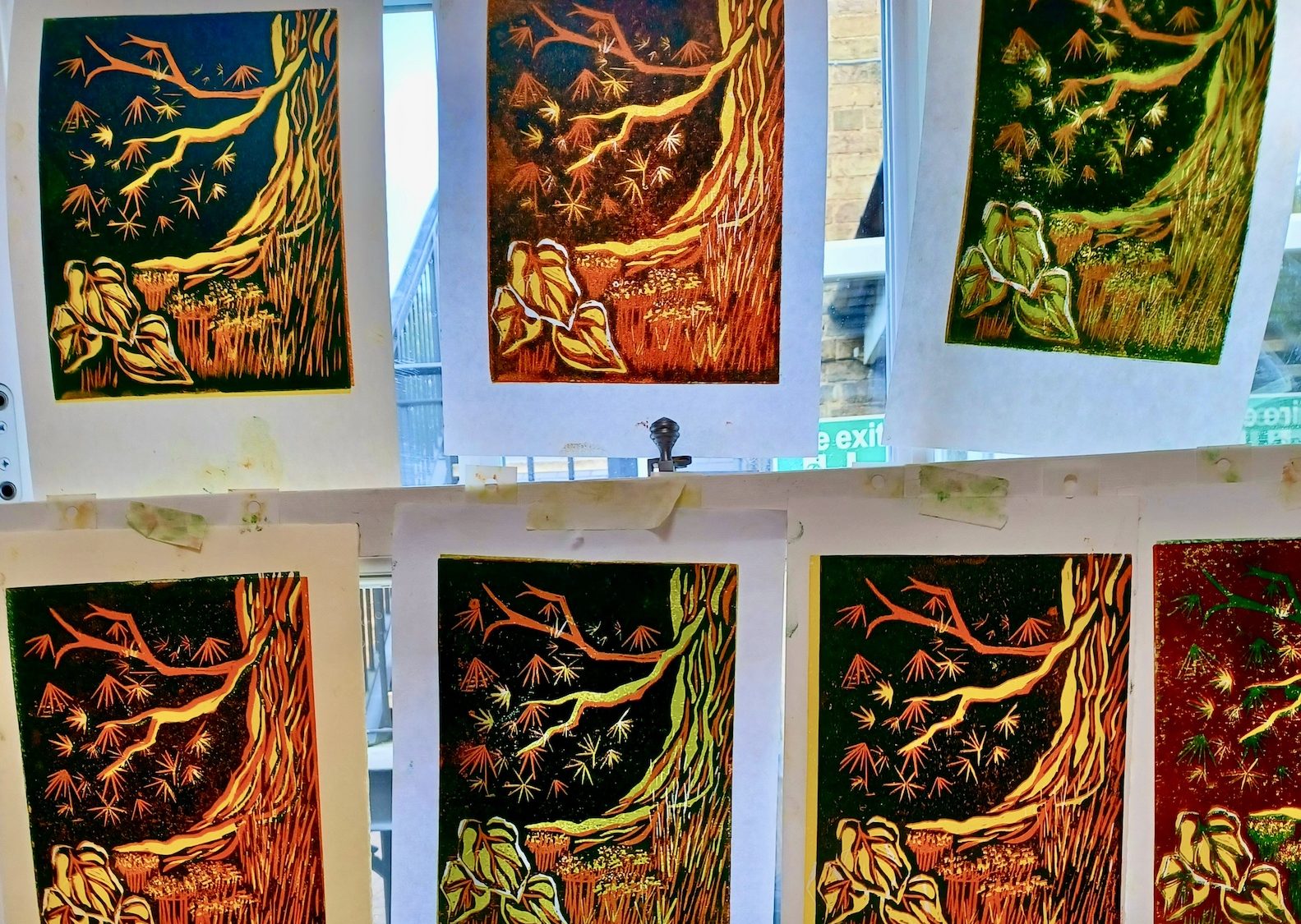 a linocut image of tree trunks