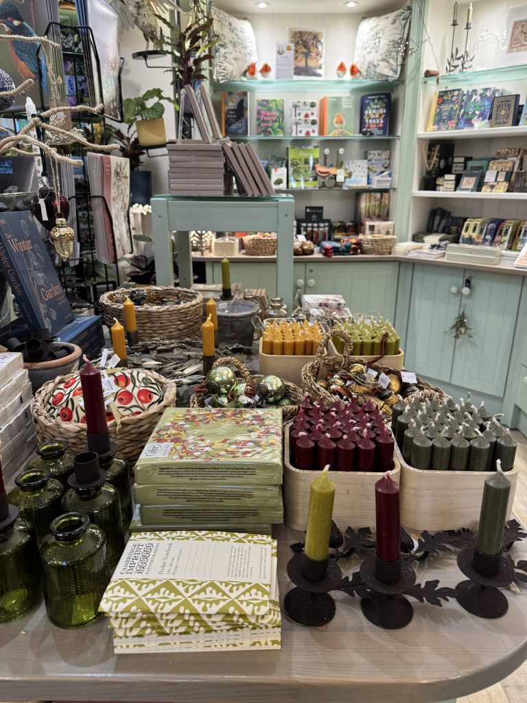 A shop display of candles, napkins and other homewares.