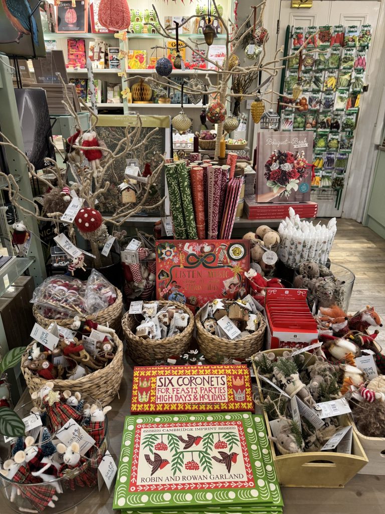 Shop display of Christmas decorations and gifts.