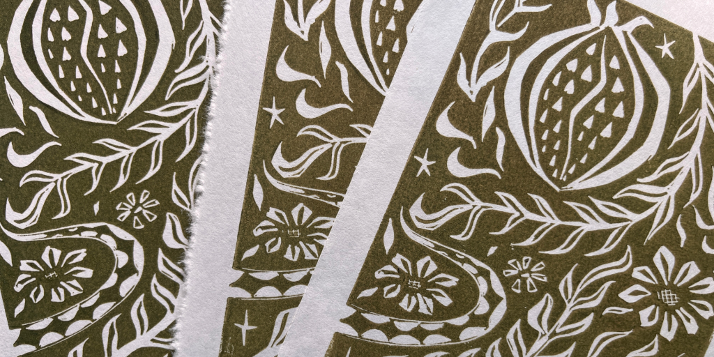 an abstract linocut image of flowers and fruits