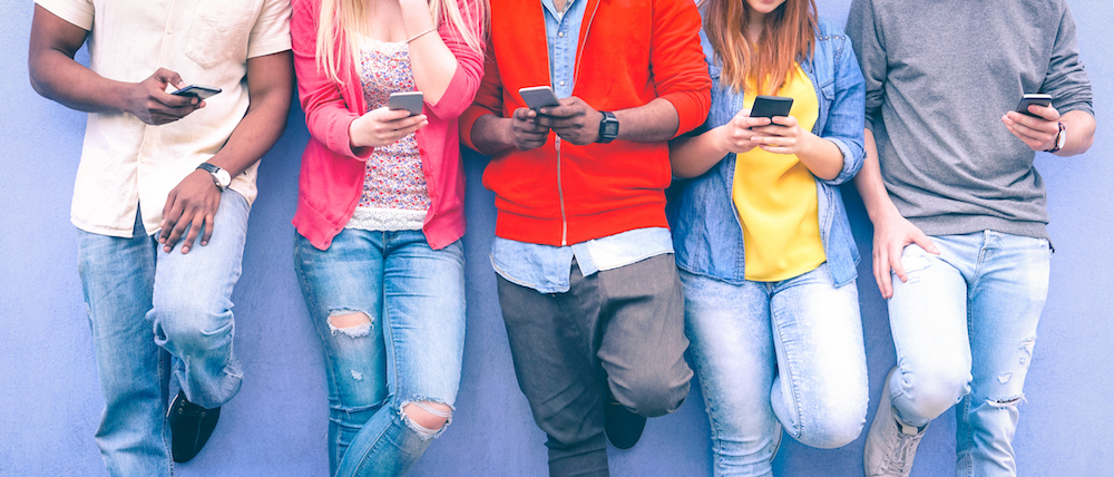 students play with their mobile phones