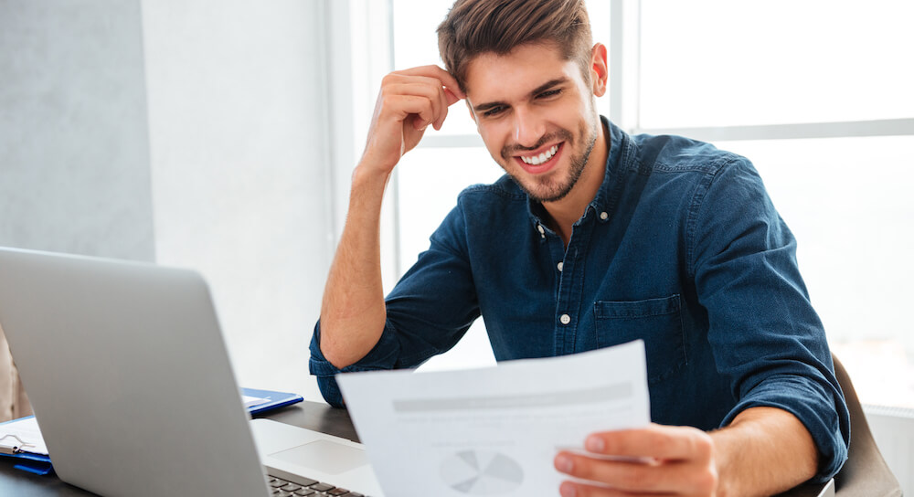 man eyes up energy bill
