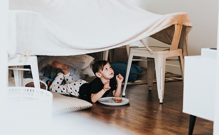 Boy in homemade den
