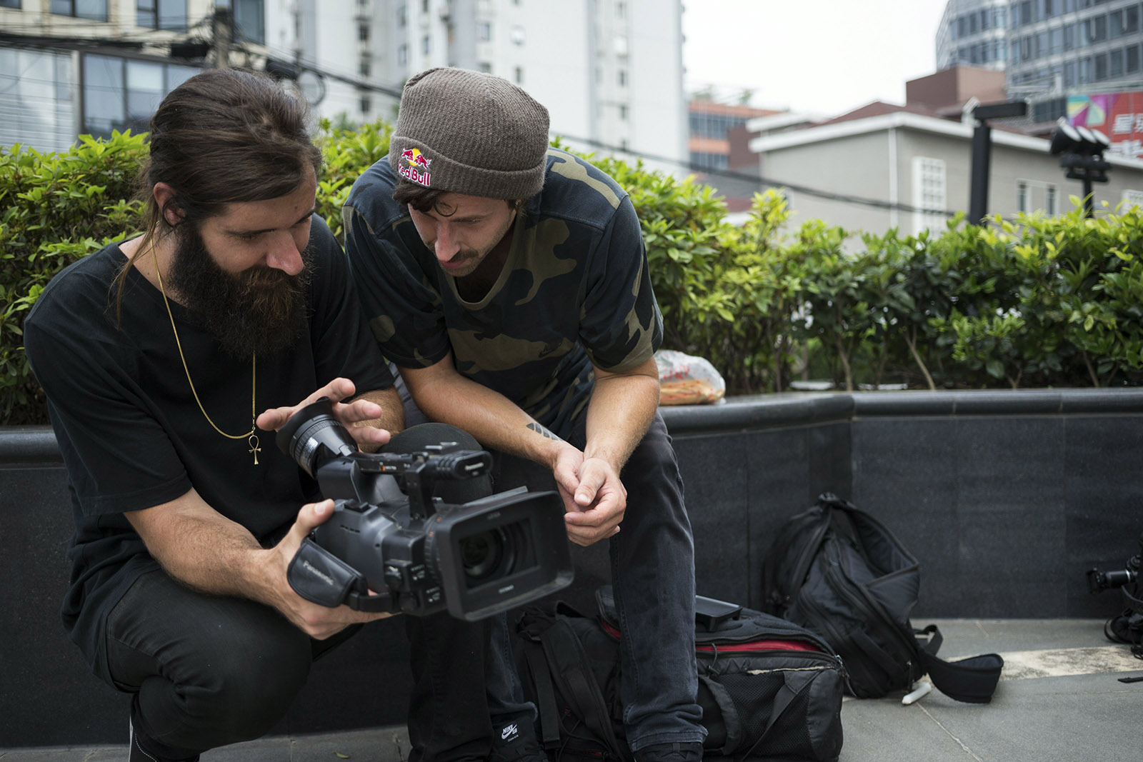 Garrett Reynolds watches a replay of a clip with filmer Tony Ennis during their trip to Shanghai, China, on 9 June, 2016. // Kevin Conners / Red Bull Content Pool