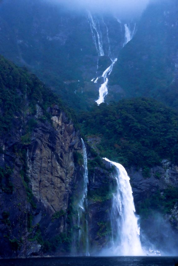Notice boat in lower right of image. Water falls in Milford Sound - the South Island of New Zealand.See other images of natural beauty by clicking on the following: