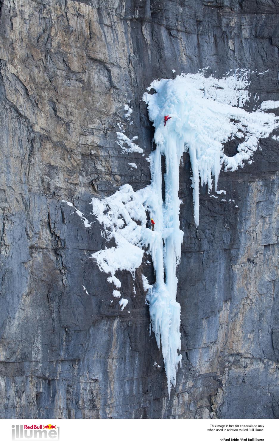 Climber Jen Olson belayed by Kyle Vassilopoulous on the hanging ice dagger known as The Real Big DripM7+ WI6+ Ghost River Canadian Rockies Alberta