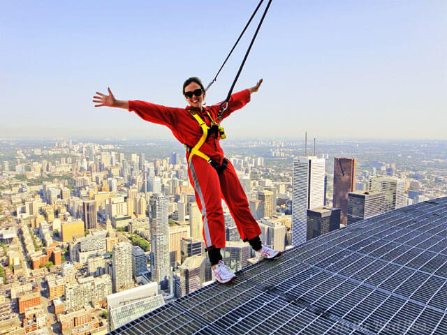 Defying gravity doing the Edgewalk on the CN Tower,Toronto