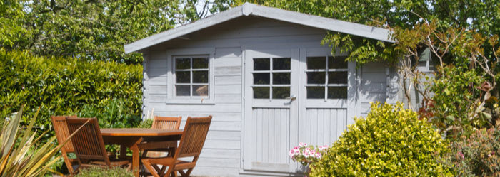 garden shed with windows and a door