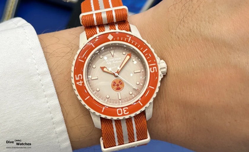 Blancpain_x_Swatch_Scuba_Fifty_Fathoms_Orange_Wrist_Biel_2023.jpg