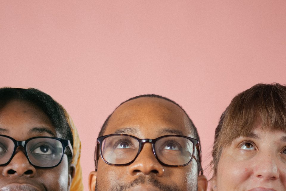 Three people looking up