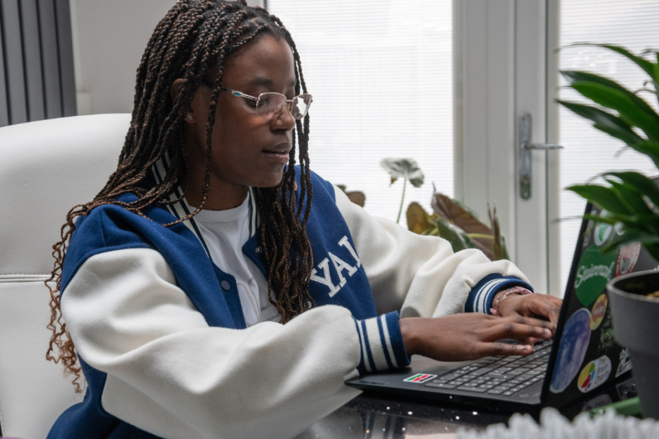 Employment readiness for autistic people: a young woman types at a laptop