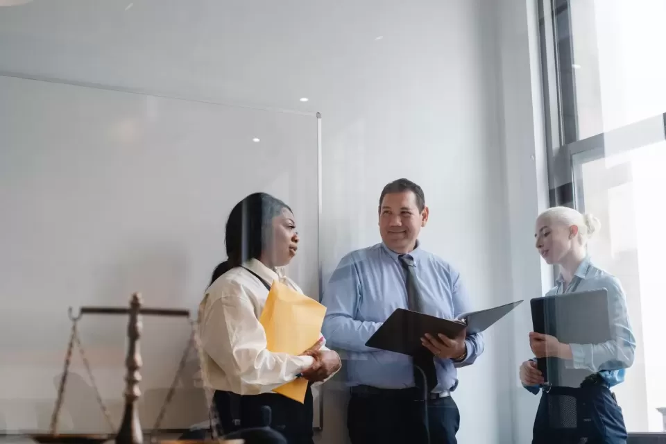 Three legal professionals talking