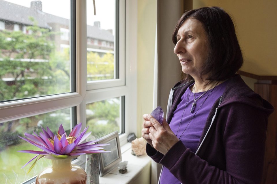 A woman looks out of the window.