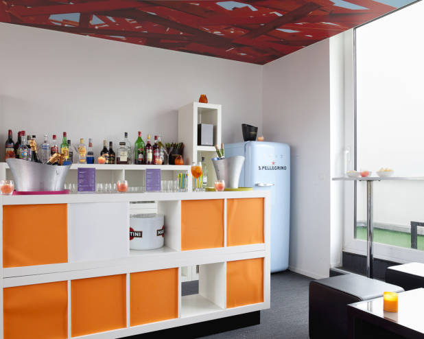 Splendid orange and red bar area in The Pantone Hotel