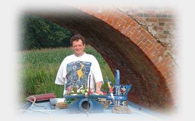 Bill steering a narrowboat