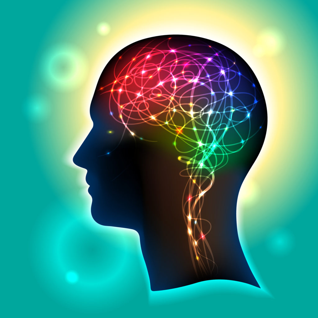 Profile of a human head with a colorful symbol of neurons in the brain