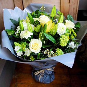 Bloom Magic - Flower Delivery Ireland - This classic flower arrangement contains a glorious combination of white and green seasonal flowers that gives off a country garden flower feel. This gift is perfect for any for any occasion, especially when presented as birthday flowers with chocolates. We offer same day delivery, and next day delivery to anywhere in Ireland.