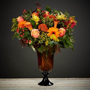 Bloom Magic - Flower Delivery Ireland - A gorgeous mix of warm autumn colours. A striking and vibrant bouquet featuring roses, gerber, calla lillies and hypericum. These flowers are a perfect gift for birthday flowers, anniversary flowers or even as a thank-you gift. Our team of florists is expert at choosing the freshest and most seasonal blooms for your bouquet. Order now for same-day flower delivery Dublin and next day Flower delivery to all of Ireland.